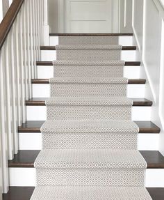 the stairs are lined with white carpet