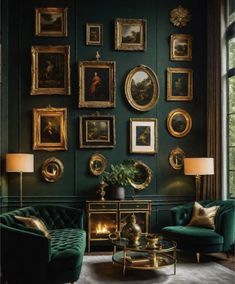 a living room filled with green couches and pictures on the wall above them in gold frames