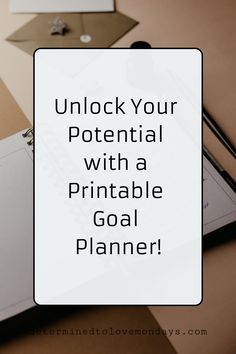 a notepad with the words unlock your potential with a printable goal planner