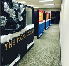 an office cubicle decorated for the polar express with snow and foil wrapped around it