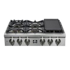 a stainless steel gas stove with four burners and two griddles on the top