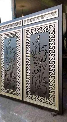 two metal panels with decorative designs on them