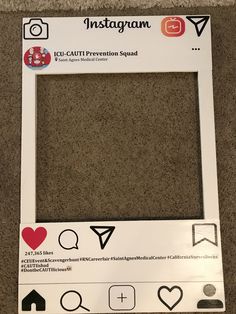 an instagramm photo frame with hearts and arrows on the front, sitting on a carpeted floor