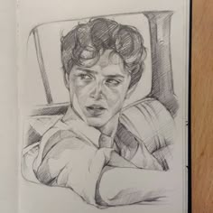 a pencil drawing of a man in a car