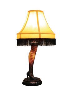 a lamp that is sitting on top of a wooden base with a black and yellow shade