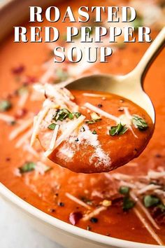 a spoon full of roasted red pepper soup