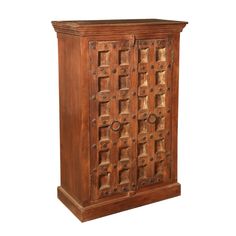 an old wooden cabinet with intricate carvings on the front and sides, isolated against a white background