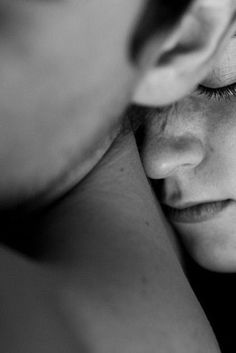 two women are looking at each other in black and white, with their eyes closed