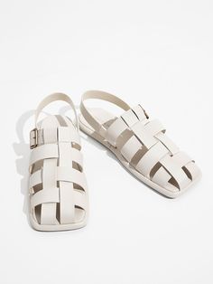 With their retro silhouette and nonrestrictive fit, caged sandals keep proving that they are here to stay. This pair comes in a fresh chalk-white finish and is fitted with a metallic buckle strap that can be adjusted, plus a back strap that offers a secure fit. Needless to say, these sandals prioritise comfort and style without missing a beat. Try them on with an asymmetric cropped playsuit and a structured bag for maximum style points. Charles And Keith Sandals, Pinterest Predicts, Charles And Keith, Retro Silhouette, Trend Forecast, Kids Belt, Chunky Heel Pumps, Structured Bag, Sandals Flats