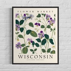 a poster on the wall with flowers and leaves in purple, green and yellow colors