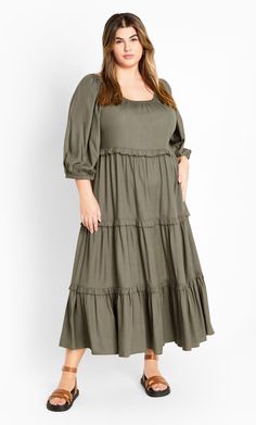 Bring your inner boho chic game, in the Heather Tier Dress. Presenting this casual relaxed fit, pull over style with a round neckline & an elongating tiered skirt, perfect for the comfort versatile styling. Key Features Include: - Round neckline - Elbow sleeves with elastic cuff - Pull over style - Tiered frilled detail - Midi hemline Pair with a denim jacket and sneakers for shopping with friends. | Plus Size Dress Heather Tier 26 in Olive, Size 18/M | City Chic Casual Tiered Maternity Dress For Spring, Bohemian Midi-length Tiered Dress For Brunch, Spring Maternity Tiered Maxi Dress, Casual Tiered Maternity Dress, Green V-neck Spring Tiered Dress, Shopping With Friends, Prairie Dresses, Tier Dress, Olive Dress