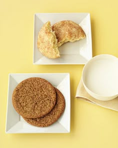 two white plates with cookies and a bowl