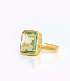 This beautiful bezel set ring is made with large rectangular faceted Green Amethyst Quartz in 18K Vermeil Gold. The ring has a 925 stamp. Gemstone size is 13 x 18 mm. Please specify your size at checkout. Since I use natural gemstones, the stones may vary slightly in color, shape and size. Due to the nature of this stone there are natural inclusions and small internal cracks. This ring is available in two finishes: ✦ 18K VERMEIL GOLD ✦ BRIGHT STERLING SILVER Please leave me a note at checkout wh Luxury Gold Birthstone Ring With Smooth Bezel, Rectangle Ring, Gold Stacking Ring, Green Emerald Ring, Green Amethyst Ring, Gold Vermeil Jewelry, Bezel Set Ring, Ring Bezel, Gold Gemstone Ring