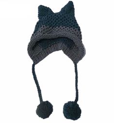 a knitted hat with two pom poms on the brim and one ear flap