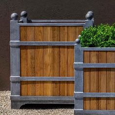 two wooden planters sitting next to each other