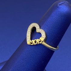 Give this as a perfect gift to your mom with real diamonds. This ring is available in 10k yellow gold with genuine white diamonds. Metal: 10k GoldStone: DiamondTotal Carat Weight: 0.06Type: RingRing Size: 7Heart: 13mm x 12mm West Indian Bangles, Mom Ring, Picture Pendant, Bangles Indian, Gold Stone, Name Jewelry, Kids Jewelry, Diamond Heart, Real Diamonds