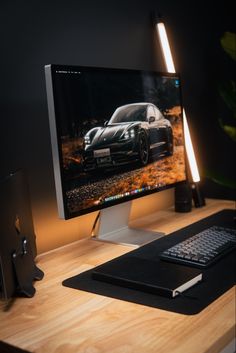 a desktop computer sitting on top of a wooden desk