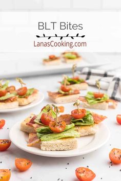 small sandwiches with tomatoes and lettuce on them are ready to be served in the kitchen