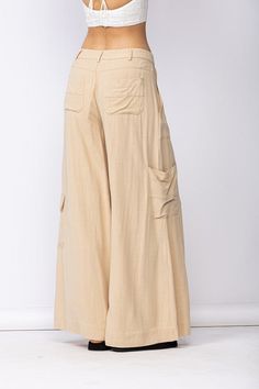 Final Sale - Get it before it's gone! Style the Cape May Beige Linen Wide-Leg Pants with your favorite summer top for a chic summer look! Linen blend fabric shapes these wide-leg pants with side cargo pockets and back patch pockets. DETAILS & CARE 70%Viscose, 30% Linen Machine Wash Cold. Imported. Summer Wide-leg Parachute Pants With Pockets, Wide Leg Harem Pants With Pockets For Beach, Spring Bohemian Bottoms With Side Pockets, Bohemian Bottoms With Side Pockets For Spring, Beige Parachute Pants With Pockets For Summer, Loosely Fitted Beige Wide Leg Pants With Side Pockets, Bohemian Long Pants With Side Pockets, Relaxed Fit Wide Leg Cargo Harem Pants, Wide Leg Parachute Pants With Pockets For Vacation