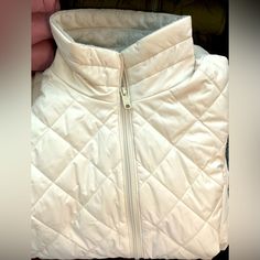 Light Weight Women’s Columbia Jacket. Beige Fleece-lined Outerwear For Spring, White Quilted Jacket For Spring, White Quilted Jacket With Pockets For Spring, White Quilted Puffer Jacket For Cold Weather, White Fleece-lined Outerwear For Fall, Casual Quilted Winter White Outerwear, Casual Quilted Outerwear In Winter White, Casual White Puffer Jacket With Fleece Lining, White Fleece-lined Outerwear For Cold Weather