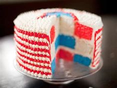 a red, white and blue cake on a glass plate