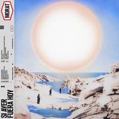 an album cover with two people walking on snow covered ground and the sun in the background