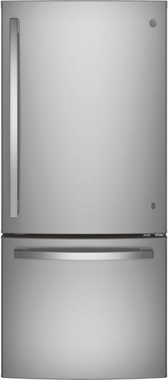 a silver refrigerator freezer sitting on top of a counter