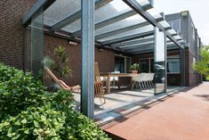 an outdoor patio area with chairs and tables