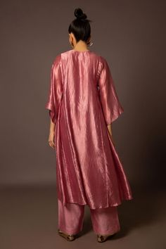 Rose pink dupion silk kurta with pitta hand embroidered neckline and side panels. Comes with pant.
Components: 2
Pattern: Hand embroidered
Type Of Work: Pitta
Neckline: Notched
Sleeve Type: Flared Sleeves
Fabric: Dupion silk
Color: Pink
Other Details: 
Model Height: 5ft 11inches, wearing size S
Closure: Kurta - Front button
Occasion: Mehendi and Haldi - Aza Fashions Silk Kurta, Dupion Silk, Embroidered Neckline, Pant Set, Side Panels, Set For Women, Flared Sleeves, Rose Pink, Model Height