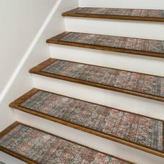 a set of stairs with carpet on them