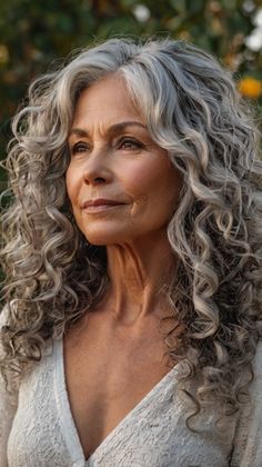 Curly Hairstyles for Women Over 50 Long Grey Curly Hair Over 50, Celebrities With Grey Hair, Curly Hair Over 60 Women, Silver Curly Hair Natural Curls, Salt And Pepper Curly Hair, Gray Curly Hair Natural Curls, Curly Grey Hair Natural Curls, Long Curly Gray Hair, Curly Gray Hair Over 50