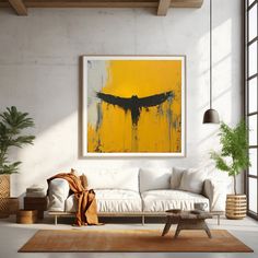 a living room filled with furniture and a large painting on the wall above it's couch