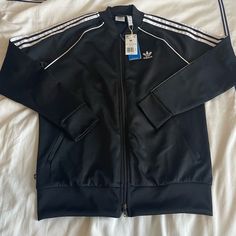 Nwt Adidas Sst Track Jacket Size M Adidas Sst, Adidas Winter Outerwear With Three Stripes, Black Track Jacket With Three Stripes For Winter, Black Athleisure Outerwear With Three Stripes, White Outerwear With Three Stripes Branding For Fall, Adidas Spring Outerwear With Three Stripes Branding, Adidas Winter Outerwear With Three Stripes Branding, Adidas Long Sleeve Outerwear With Three Stripes, Adidas Outerwear With Three Stripes For Fall