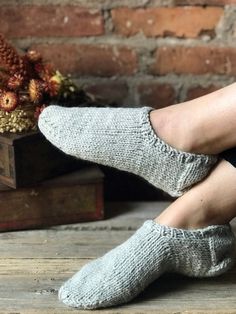 "65% Wool / 35% Alpaca hand knit Brooklyn slippers in Stone (light grey) color. Ribbed opening hugs the ankle. Sock style slipper. Worsted weight. Unisex. No acrylic. Natural fibers only. Sizing: Women's S / Men's XS:  8 5/8\" - 9 1/8\"  foot length Women's M / Men's S: 9 1/4\" - 9 3/4\"  foot length Women's L / Men's M: 9 7/8\" - 10 1/2\"  foot length" Sock Style, Light Grey Color, Ankle Sock, Fashion Socks, Alpaca Wool, Worsted Weight, Grey Color, Natural Fibers, Alpaca