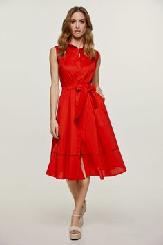 This sleeveless dress is crafted in lightweight woven stretch gabardine fabric. There is a collar and a placket in the front to the hem with decorative shell style buttons. It has a decorative perforated braid, tone on tone, under the shoulders in the front and back and 19cm from the hem. There is seam detail in the front and darts at the bust to ensure a perfect fit. It has a belt in the same fabric, 5cm width, with pleats in front and back. There are 2 interior pockets in the front. Our model is 172cm and is wearing size 36/S. Measurements for size 36 (in cm): Shoulder -34; Chest-42; Waist-36; Bottom-68; Body length-112. 97% cotton-3% elastane Gentle machine wash. Turn garment inside out. Cold water. Mild detergent. Iron on reverse side. Do not tumble dry. Do not bleach. Elegant Sleeveless Dress With Button Closure, Collared Sleeveless Dress For Summer Workwear, Solid Summer Dress With Placket, Summer Dress With Placket, Summer Dress With Solid Color And Placket, Chic Button-up Sleeveless Dress For Work, Sleeveless Buttoned Dress For Spring Formal, Chic Sleeveless Button-up Dress For Work, Chic Sleeveless Collared Dress For Spring