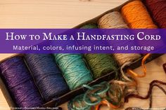 a box filled with different colored yarn on top of a wooden table