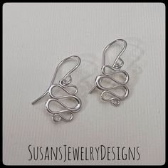 "These earrings are made with curved wire shaped into a neat squiggle design and hangs from ear hooks. Very lightweight and comfortable to wear. All components are sterling silver. Earring drop measures a little over 3/4\" from top of ear hook to bottom of squiggle area. Comes wrapped and ready to gift if needed. If you need more pairs of earrings than are available for purchase, please convo me before purchase and I help with additional quantities. To see my other earring items, click here: htt Nickel Free Jewelry With A Modern Twist, Adjustable Hypoallergenic Sterling Silver Wrap Earrings, Modern Twist Sterling Silver Hoop Earrings Gift, Everyday Sterling Silver Wire Wrapped Jewelry, Modern Twist Silver Jewelry With Ear Wire, Modern Twist Matching Drop Earrings, Modern Twist Nickel-free Silver Jewelry, Modern Twist Silver Nickel-free Jewelry, Modern Twist Sterling Silver Jewelry