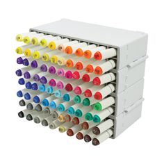 an assortment of crayons and markers are stacked on top of eachother