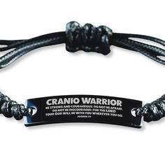 a black and white bracelet with the words cranio warrior on it's side