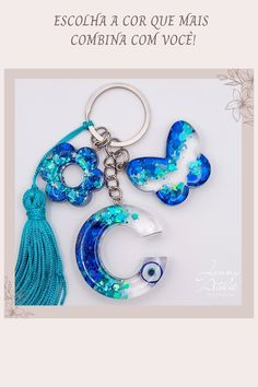 a keychain with blue and white designs on it