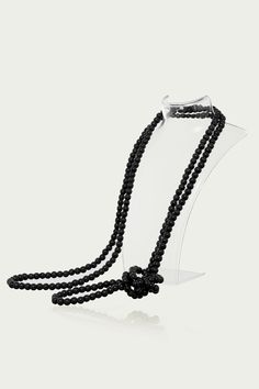 This sumptuous piece of jewelry features a retro-elegant yet slightly modern style that complements the lavish garments, reminiscent of the roaring 1920s. Features: Lustrous imitation pearls Minimalist design 69 inch / 175cm long Pearl size: 8mm in diameter Elegant Black Beaded Pearl Necklace, Elegant Black Pearl Necklace For Evening, Elegant Black Lariat Long Necklace, Long Beaded Pearl Necklace For Formal Occasions, Formal Long Beaded Pearl Necklace, Formal Black Beaded Necklace, Elegant Long Pearl Chain Necklace For Party, Elegant Beaded Long Necklace For Formal Occasions, Elegant Long Beaded Necklace