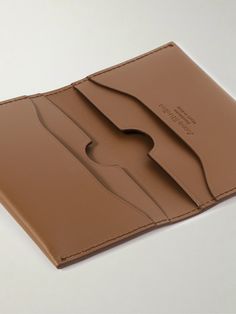 Acne Studios' no-frills wallet will serve you well for years to come. Made from pliable 'Camel' leather in a bifold design, it's fitted with four card slots and subtly gleams with silver lettering. Classic Cognac Bifold Card Holder, Classic Cognac Wallet With Interior Card Slots, Classic Brown Trifold Card Holder, Classic Cognac Card Holder With Card Slots, Classic Trifold Leather Wallet In Cognac, Classic Leather Trifold Wallet In Cognac, Cognac Bifold Wallet With Interior Card Slots, Classic Cognac Leather Trifold Wallet, Cognac Leather Card Holder With Interior Slots