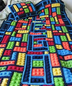 there is a crocheted blanket that looks like it has been made with squares