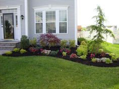 the front yard is clean and ready to be used as a flower bed or planter