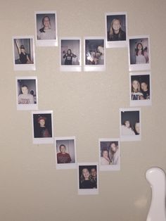 a white vase sitting next to a wall with pictures on it's side and a heart shaped frame in the middle