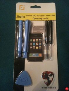 the cell phone is in its packaging with two batteries