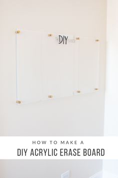 a diy acrylic erase board hanging on the wall