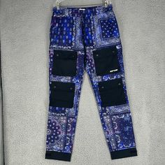 Brand New With Tag. Measurements Are Waist 17 Inches, Rise 12 Inches, Inseam 32 Inches And Length Is 43 Inches. Elastic Waist. Draw String. Cargo Pockets. Adjustable Ankle Straps. Built In Netting. Blue Paisley Print Casual Bottoms, Blue Joggers With Side Pockets, Black Nylon Cargo Pocket Joggers, Full-length Cargo Pocket Joggers For Streetwear, 4-way Stretch Sportswear Joggers With Side Pockets, Nylon Joggers With 4-way Stretch And Pockets, Cargo Pocket, Ankle Straps, Mens Pants