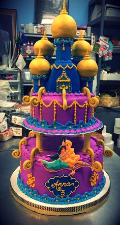 this is a three tiered cake decorated like a princess castle