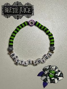 This is a Halloween bracelet inspired by the movie Beetle Juice™ Beetlejuice Beaded Bracelet, Beetle Juice Bracelets, Beetlejuice Bracelet Ideas, Halloween Kandi Bracelets, Bracelet Ideas Halloween, Beetlejuice Bracelet, Halloween Diy Jewelry, Halloween Bracelet Ideas, Halloween Kandi